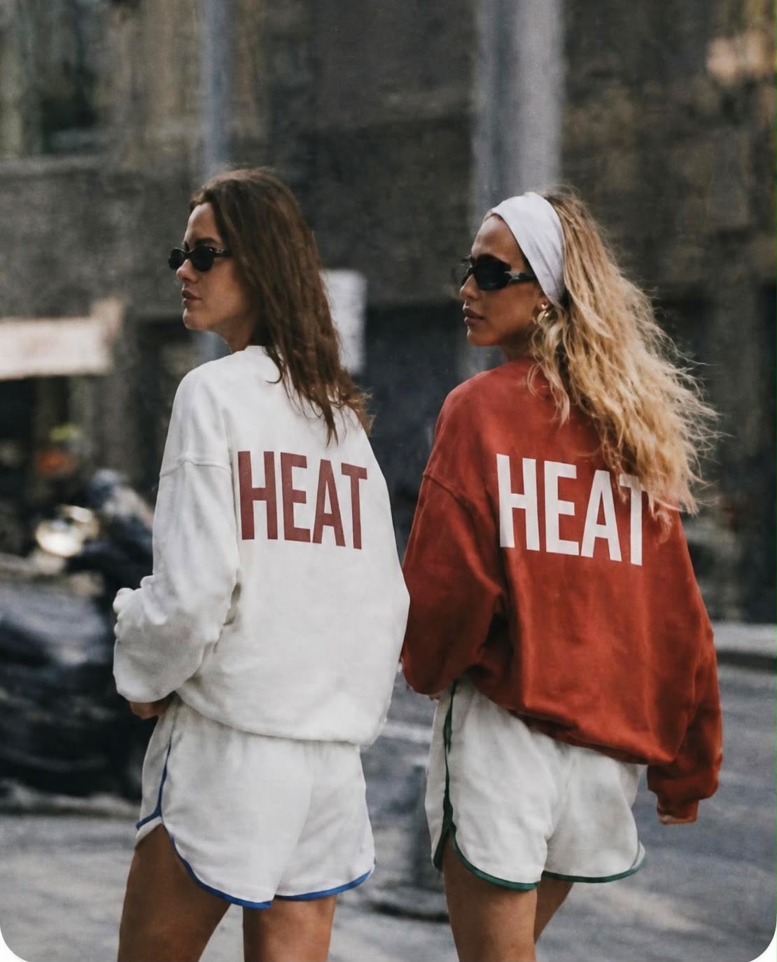 Two people wearing HEAT clothing